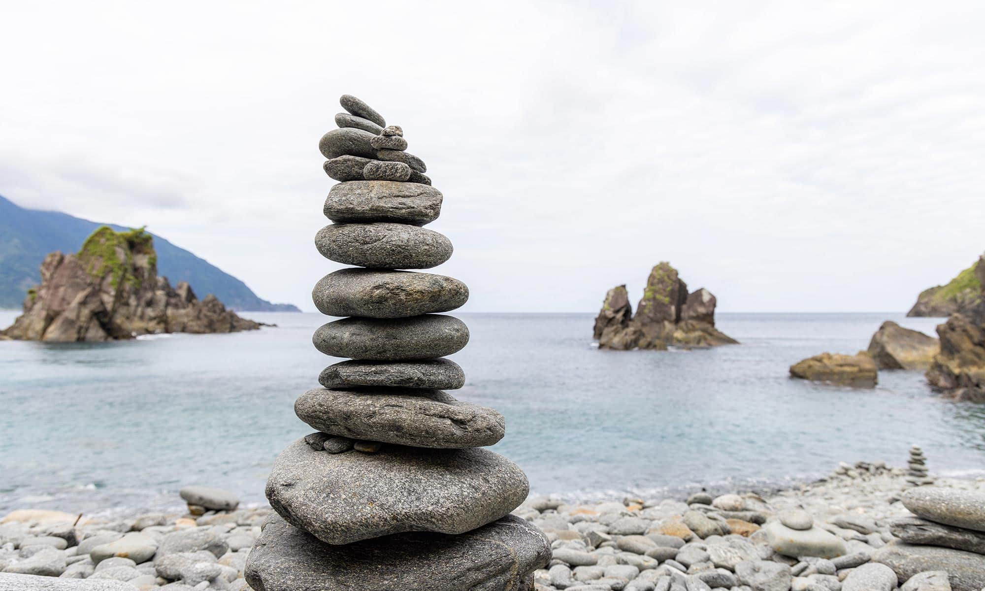 Around her neck hangs a heavy rock representing resentment, fear, anger, and self-pity