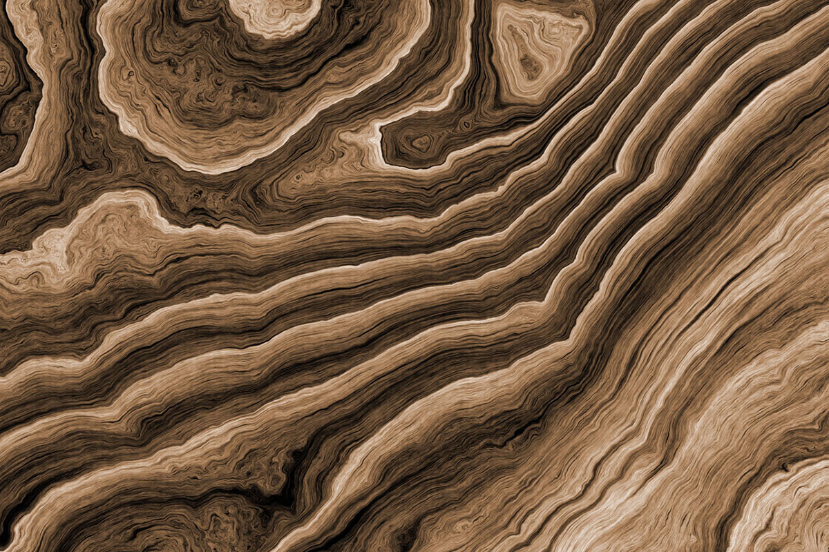 Brown abstract wood grain texture with swirling patterns.